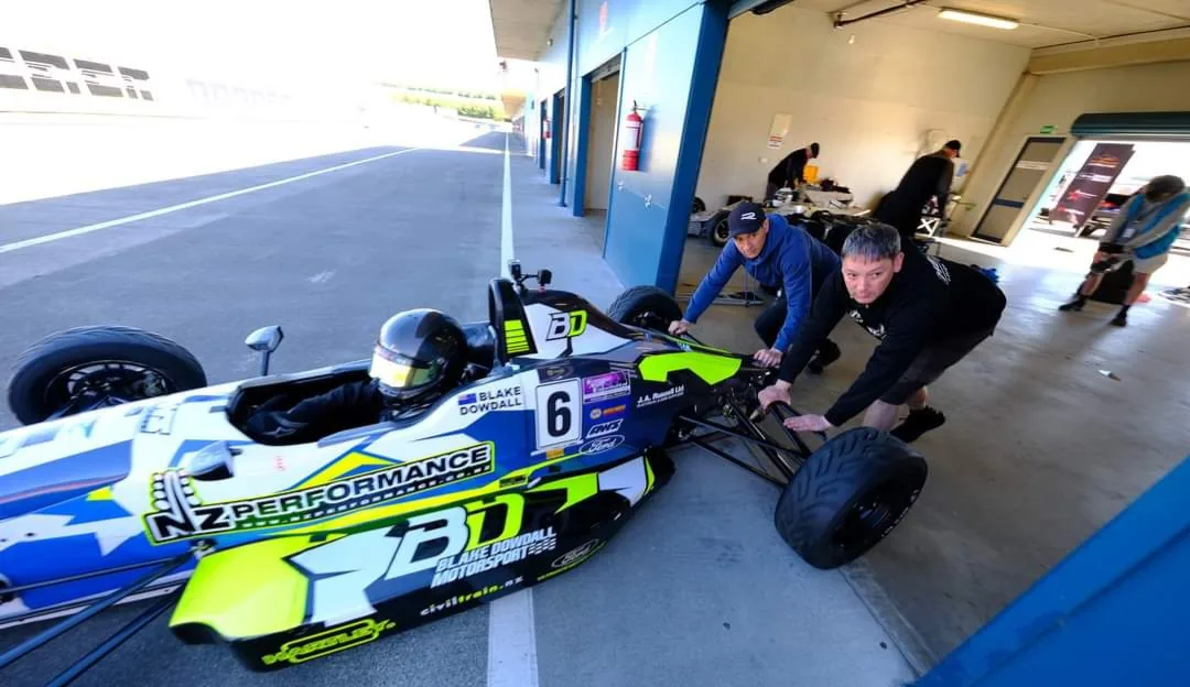 Blake Dowdall in the garage at Taupo